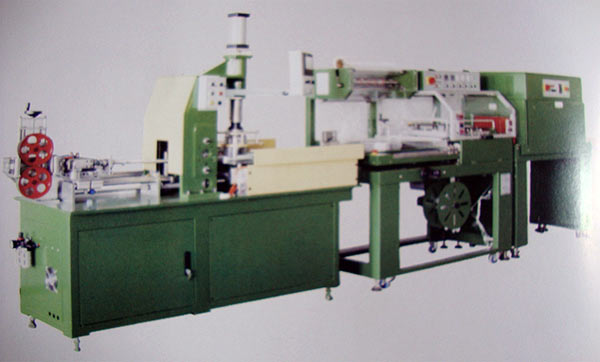 Photo of an Automated Coiling Machine with Wrapping and Shrinking Oven